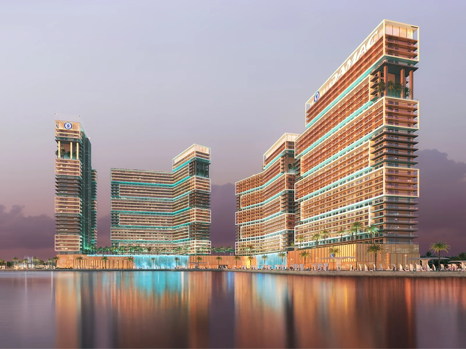A sleek glass skyscraper overlooks a calm blue sea under a clear sky in a modern waterfront district. | credit:Publicly Available