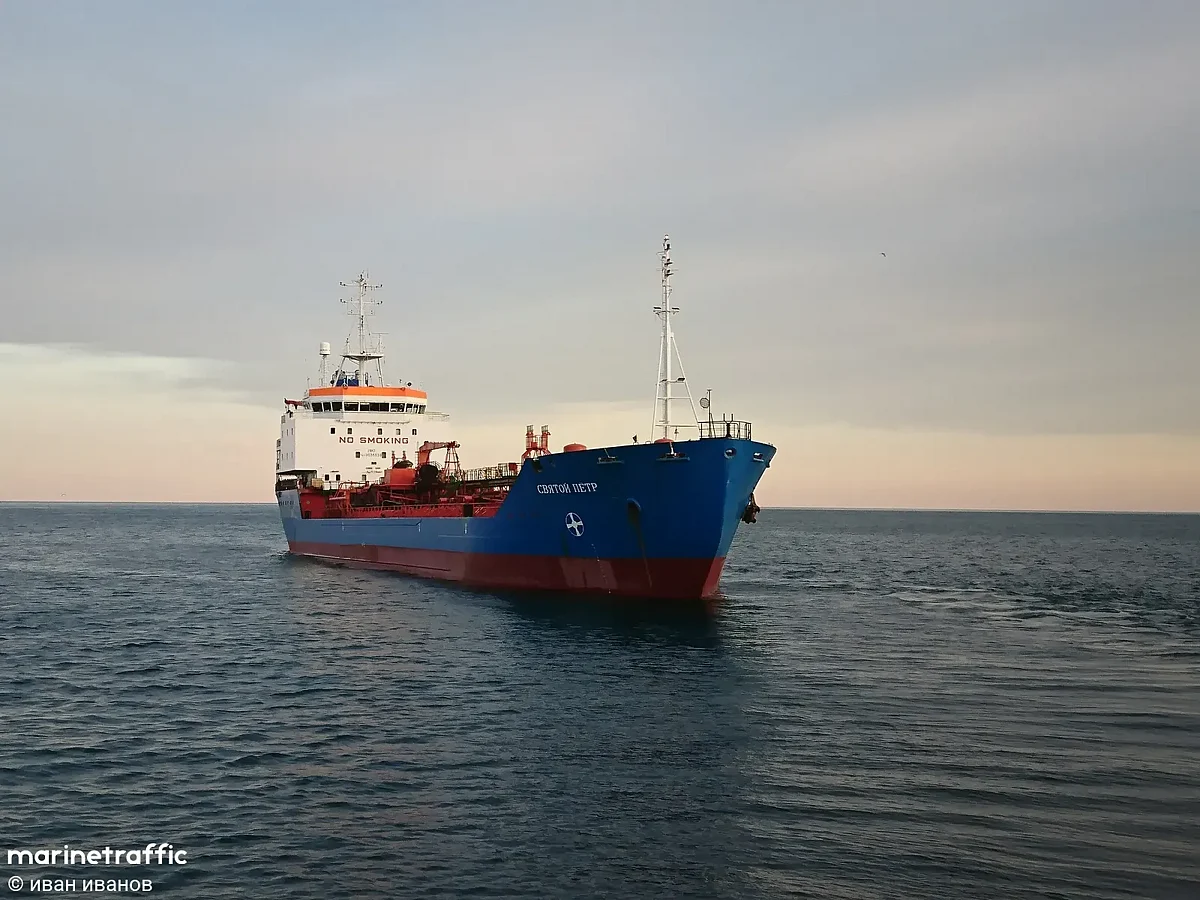 Large commercial oil tanker sails through deep blue ocean waters under a clear sky near the Somali coastline.