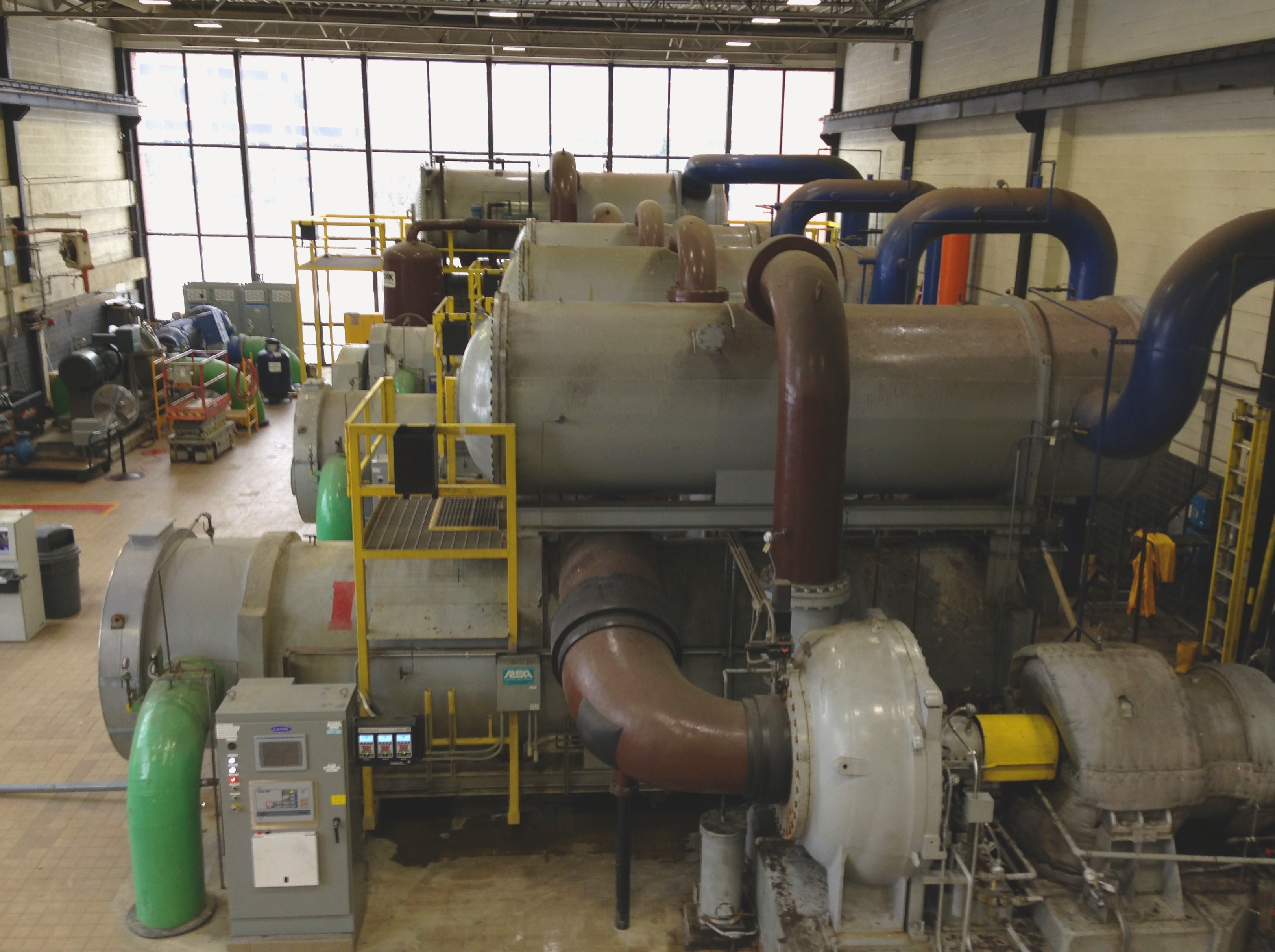 Large-scale district cooling chillers used to provide cooling infrastructure for buildings.
