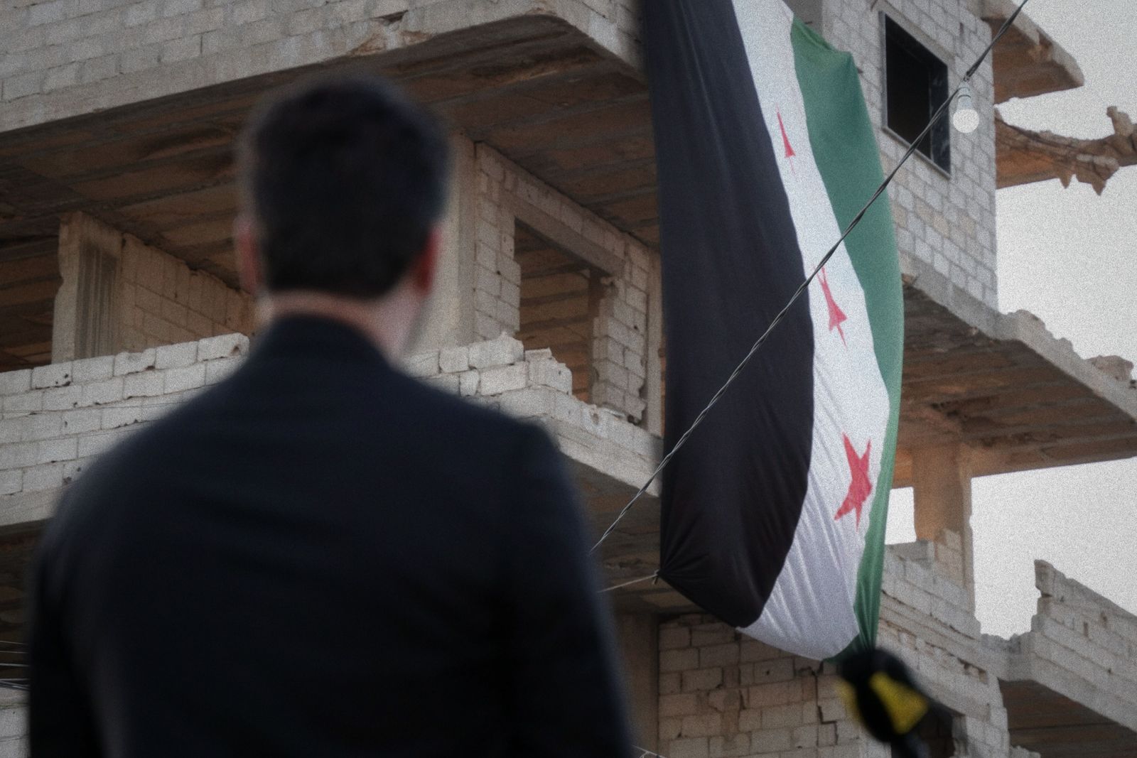 Syrian President Ahmed al-Sharaa and Mazloum Abdi stand together during an official government appointment in Damascus.