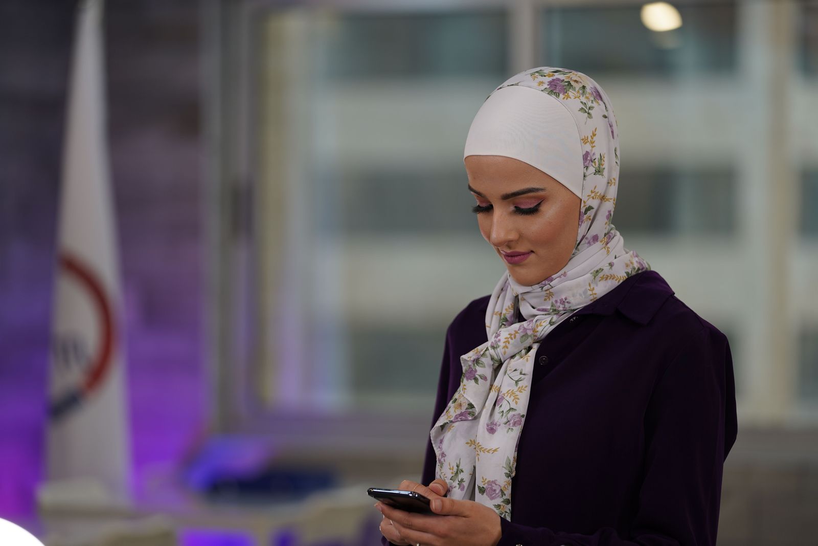 Sheikha Bodour Al Qasimi smiles while speaking at a podium during an Emirati Women’s Day event in the UAE.