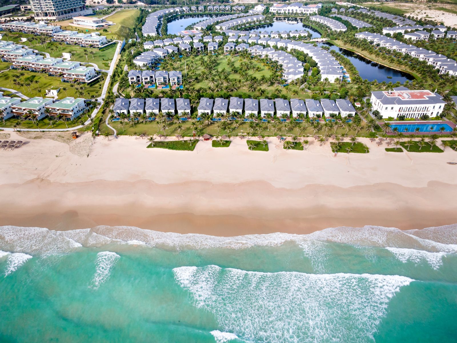 A sleek architectural rendering showcases futuristic entertainment venues and luxury residences along the Yas Island waterfront.