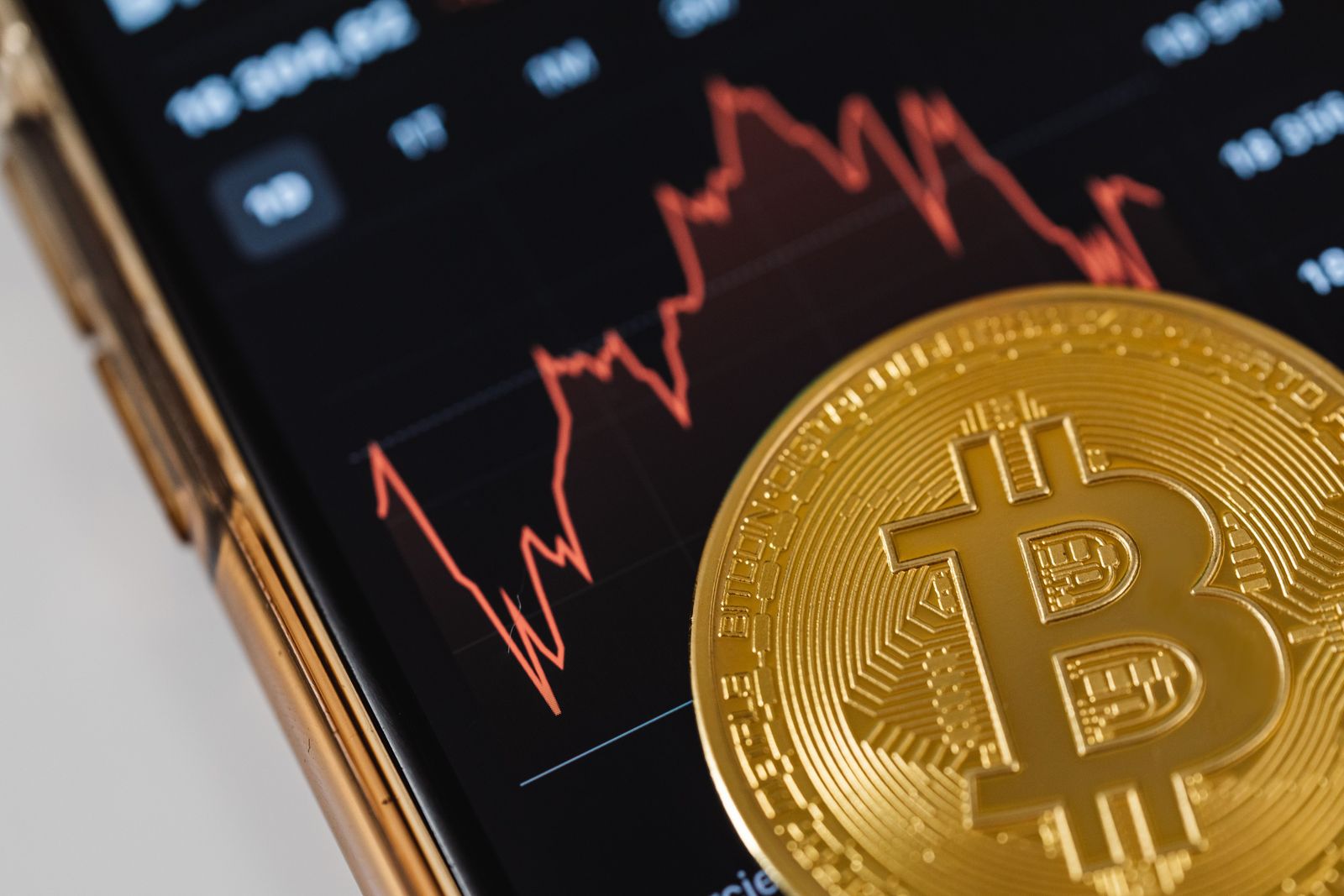 Digital icons and currency symbols glow on a complex electronic circuit board representing global financial technology.