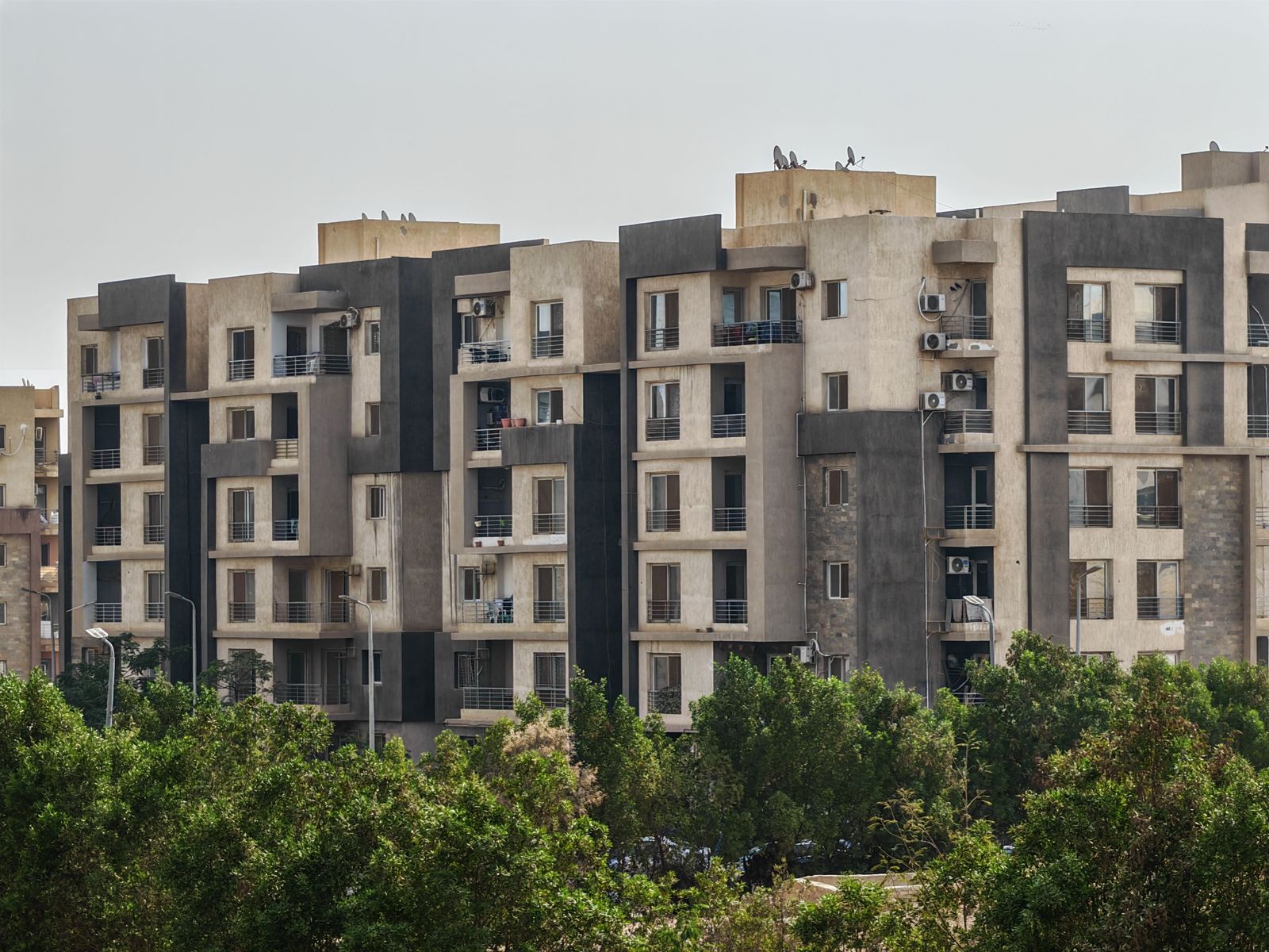 Modern high-rise apartment buildings and luxury resorts line the turquoise waterfront of Al Marjan Island in Ras Al Khaimah.