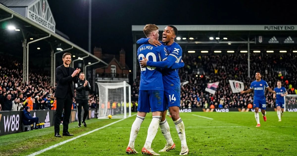 Xabi Alonso cheers from the touchline at Craven Cottage as Chelsea players celebrate a goal against Fulham.