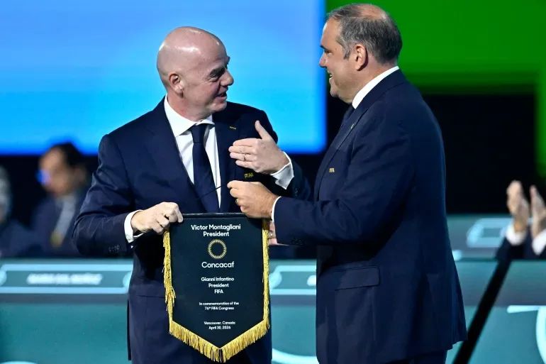 FIFA President Gianni Infantino and Concacaf President Victor Montagliani stand together during an official event.